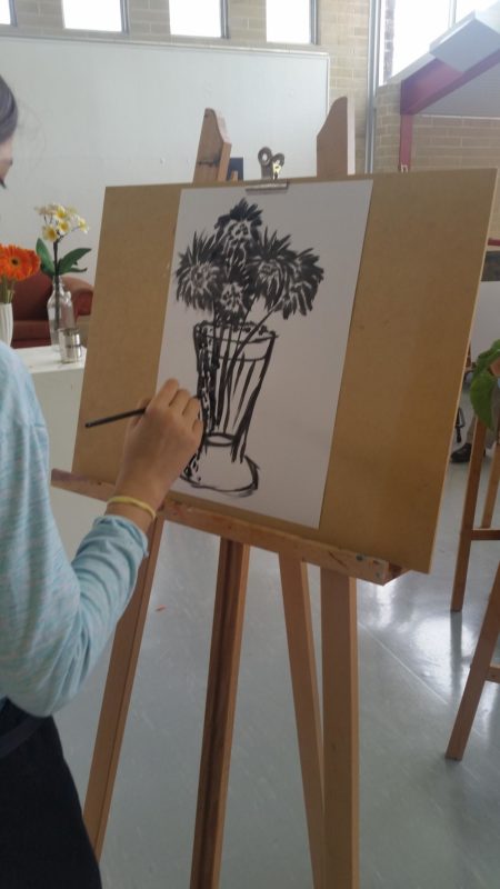 Child with painting easel