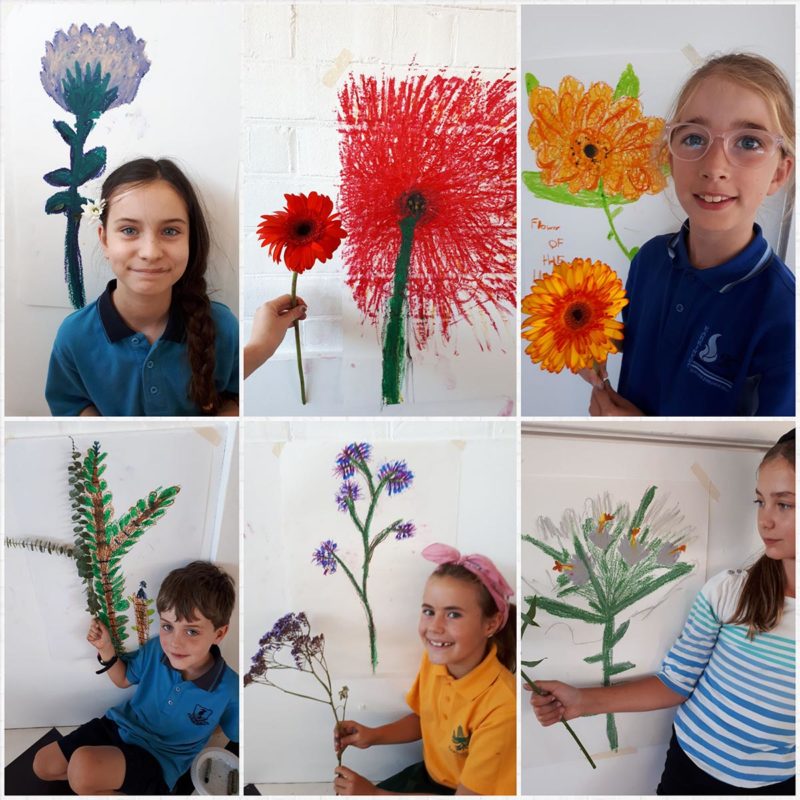 Collage of children with drawings of flowers