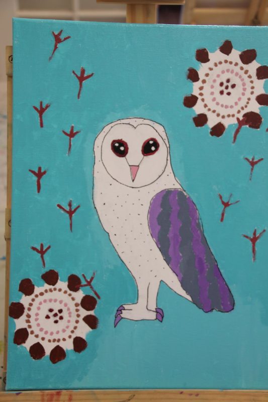 Painting of an owl on blue background