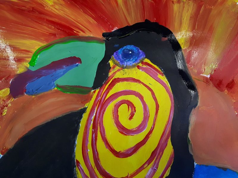 Painting of a toucan with a red spiral