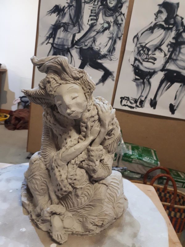 Clay sculpture of a female character