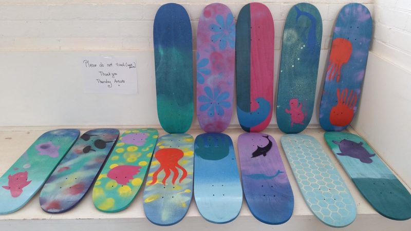 Many painted skateboard decks
